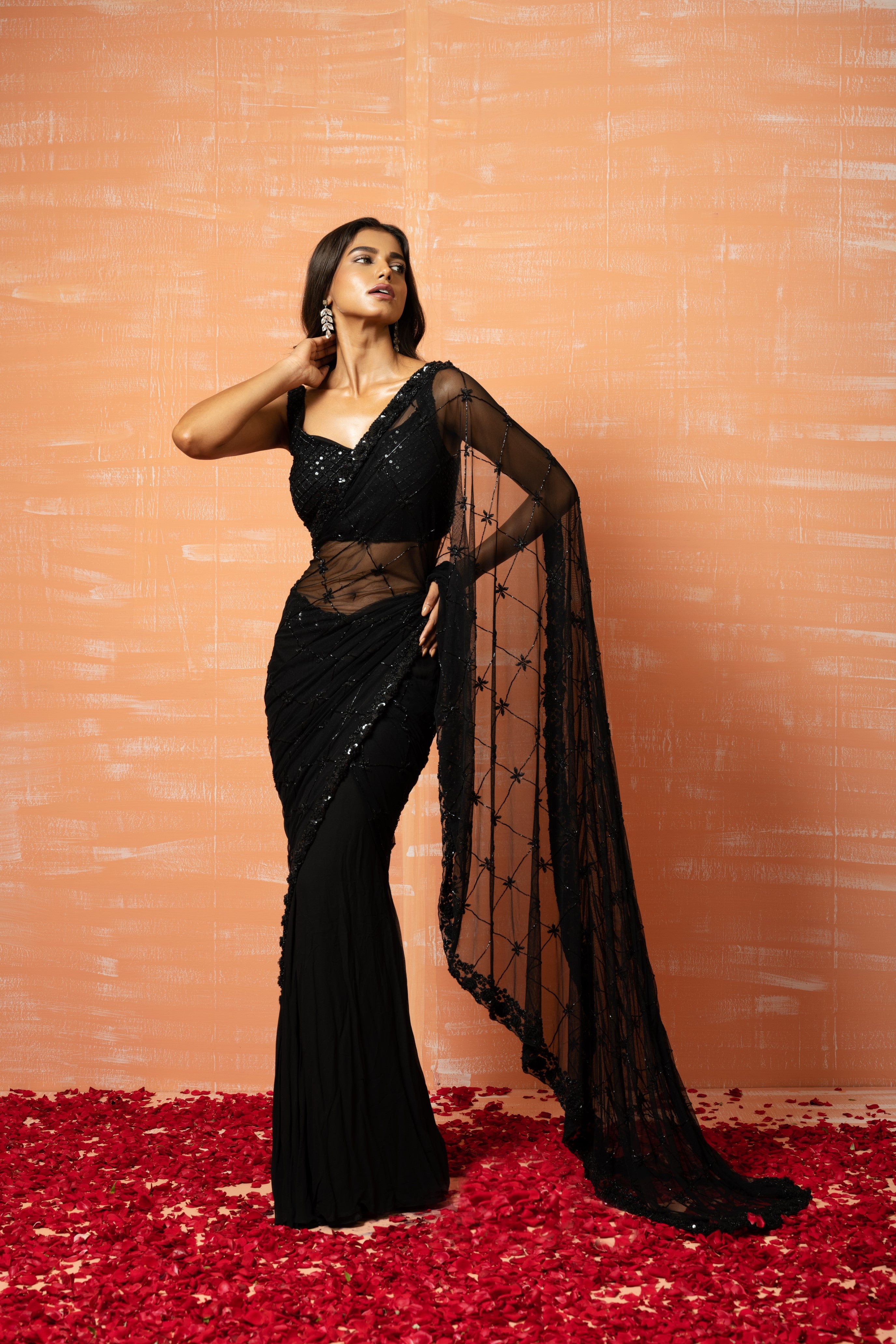 Black pre-stitched saree with hand embroidery in soft net and georgette.