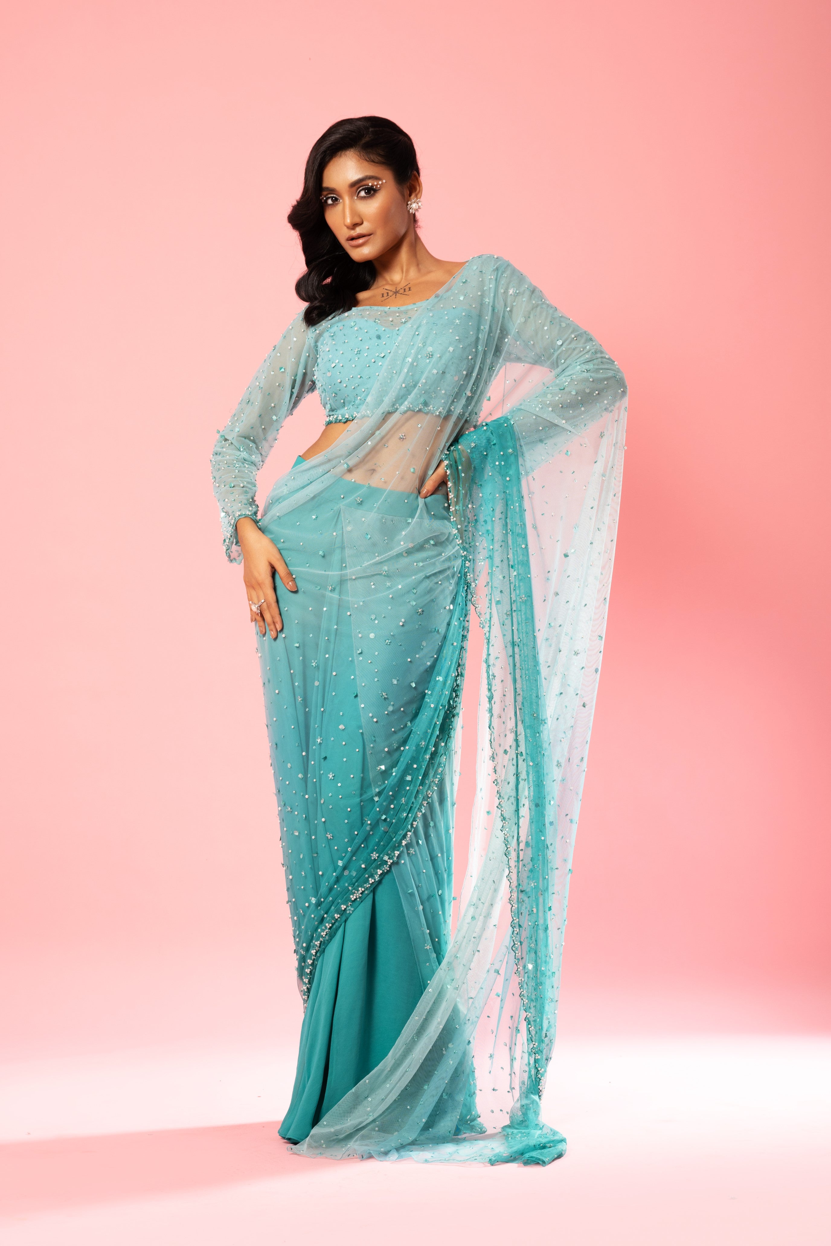 Teal and powder blue ombre pre-stitched saree with hand-embroidered blouse and pallu.