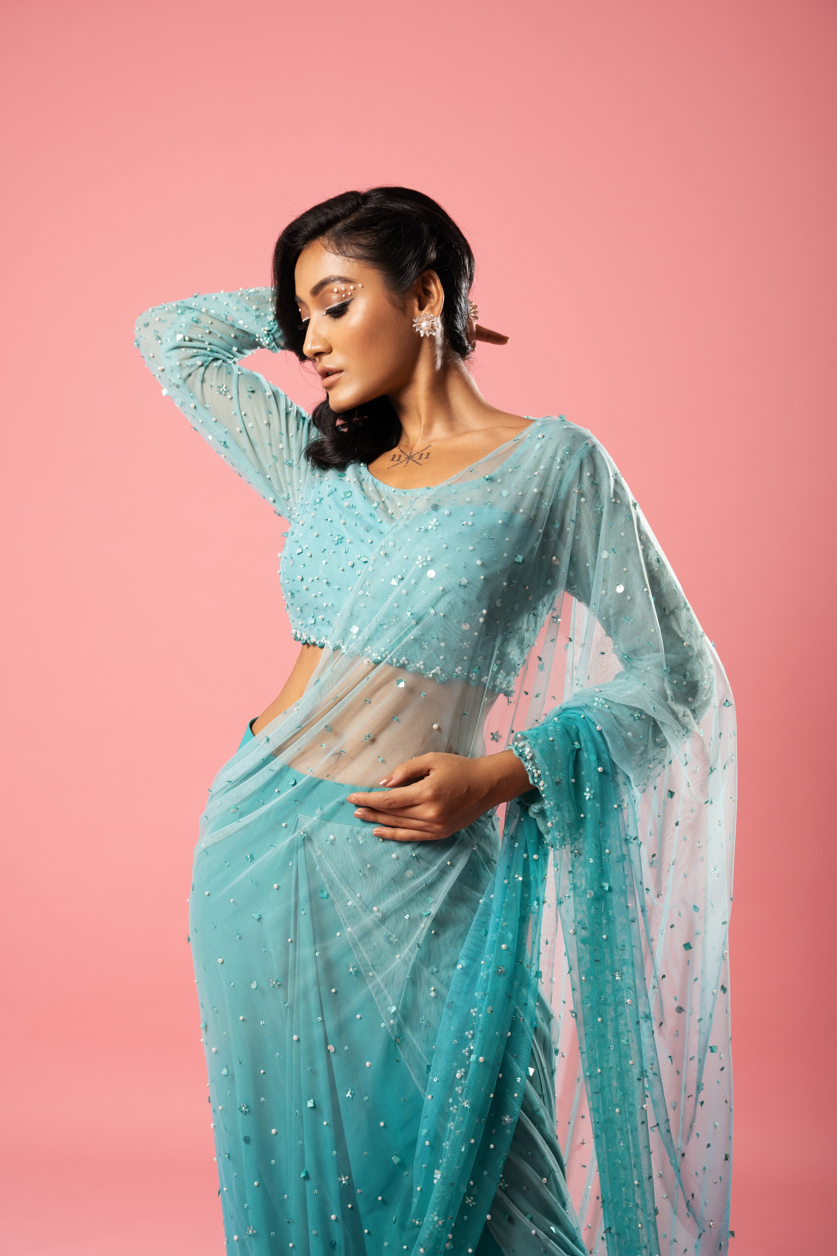 Teal and powder blue ombre pre-stitched saree with hand-embroidered blouse and pallu.