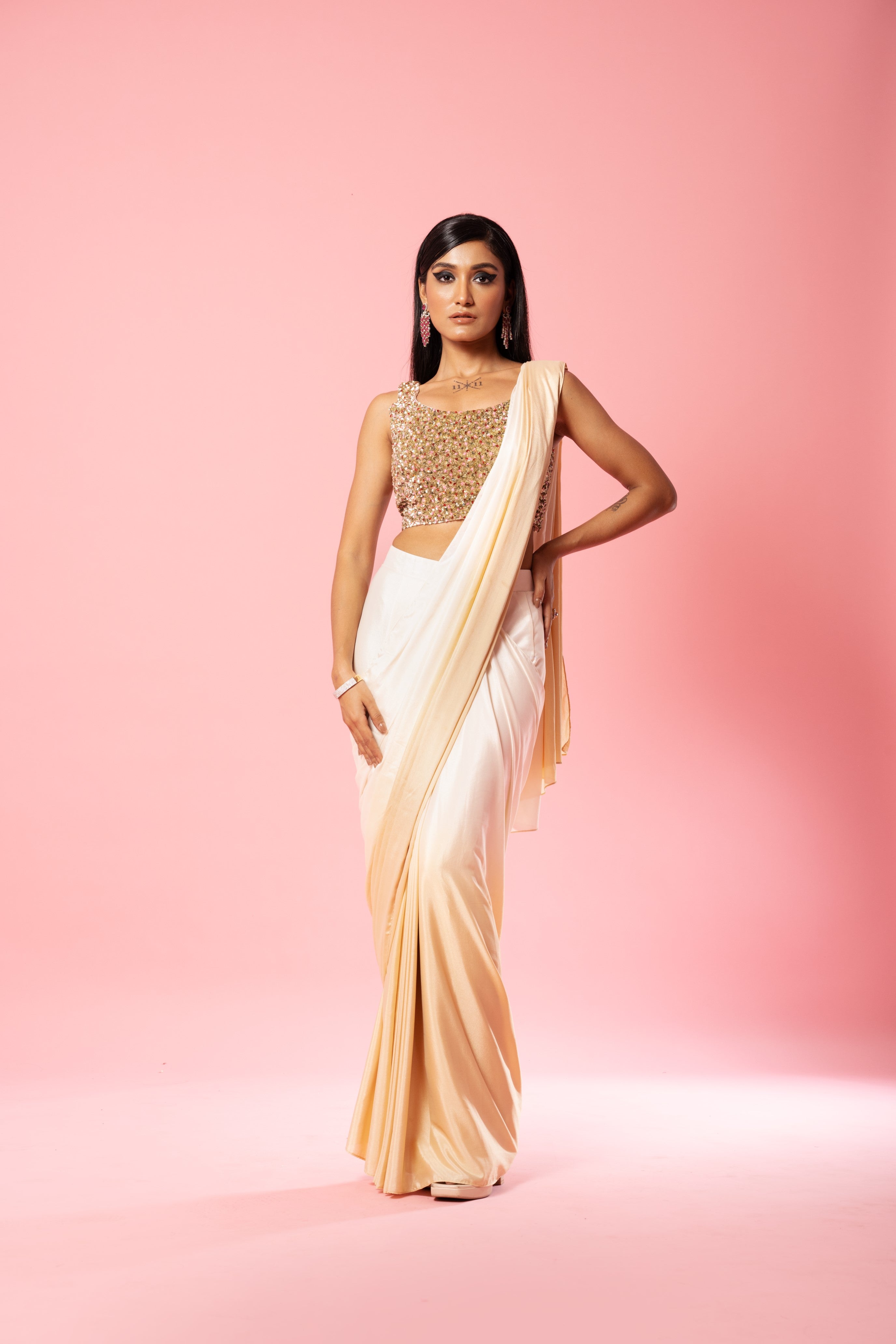 Ivory and golden ombre saree with sequin embroidered blouse.