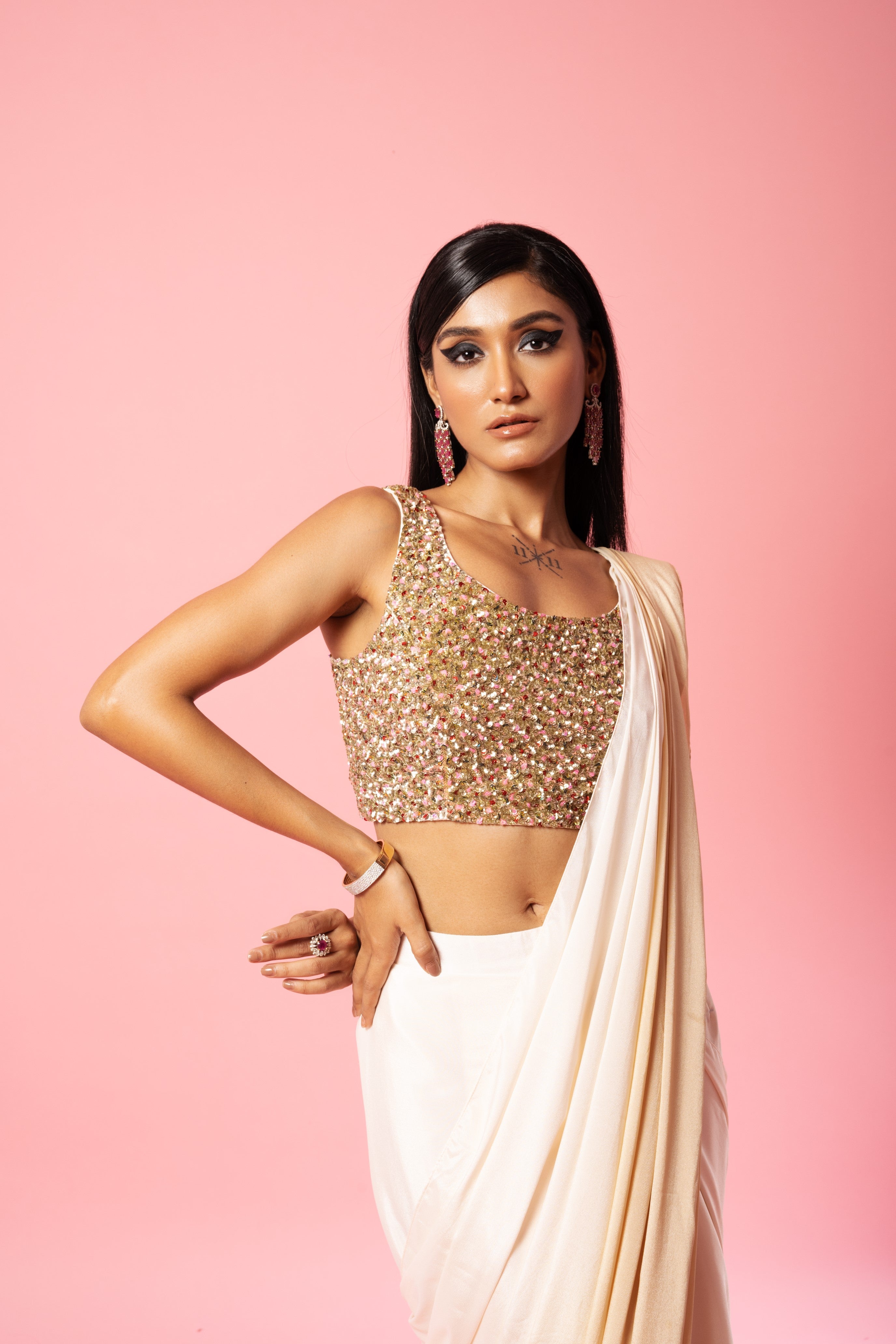 Ivory and golden ombre saree with sequin embroidered blouse.