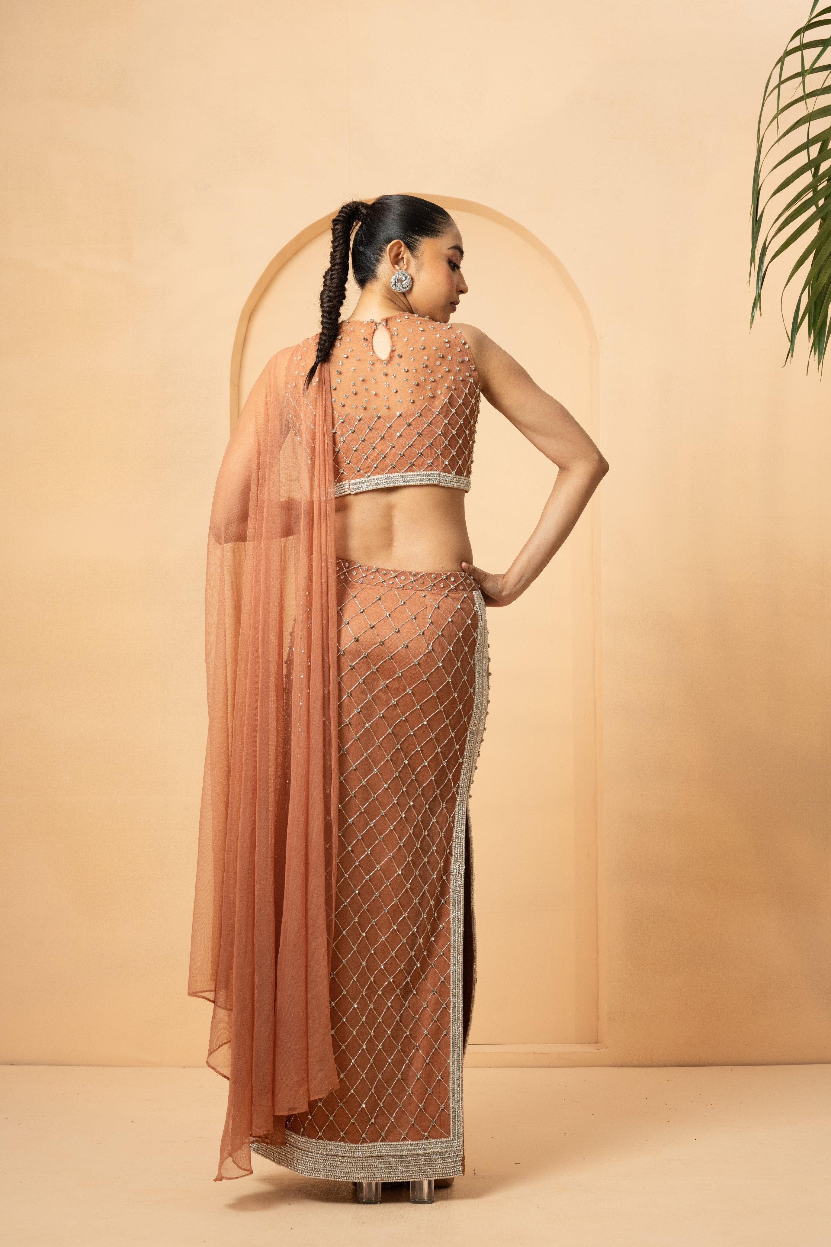 Beige pre-stitched saree with intricate embroidery and attached drape dupatta.